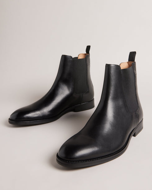 MAISONN-Boots-Step into pure luxury in leather and cotton. MAISONN are a stylish and versatile pair of chelsea boots with timeless appeal. These boots offer a sharp accent to any outfit and are finished with a subtle debossed magnolia on the heel. By purchasing this product, you are supporting responsible leather manufacturing through the Leather Working Group Chelsea boots Leather Pull tab Fully lined Closed round toe Elasticated ankle panel Ted Baker branded- Ted Baker Romania
